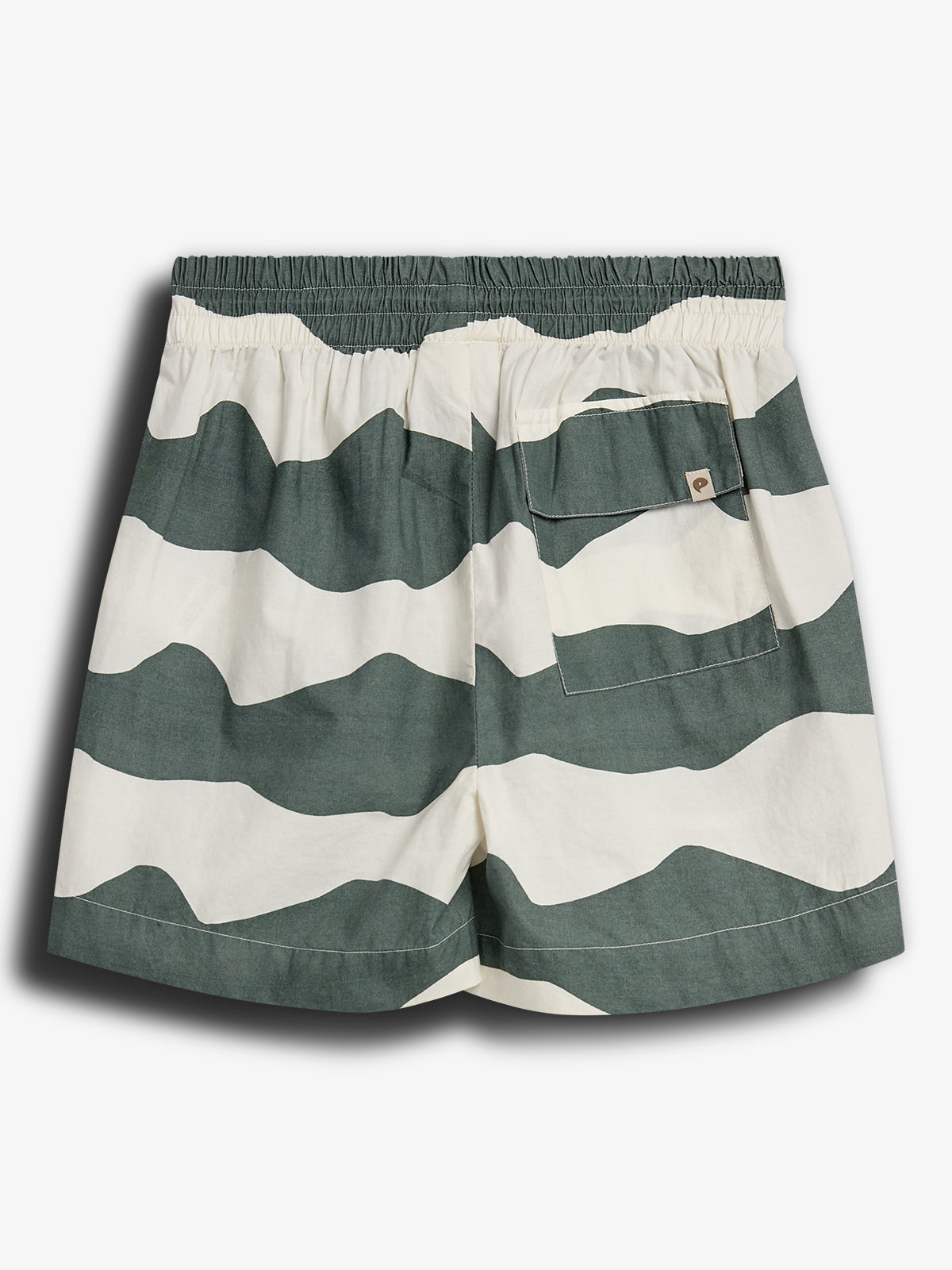 Striped shorts with green and white wave patterns are laid flat. The shorts have an elastic waistband and a small back pocket featuring a square tag with an acorn logo.