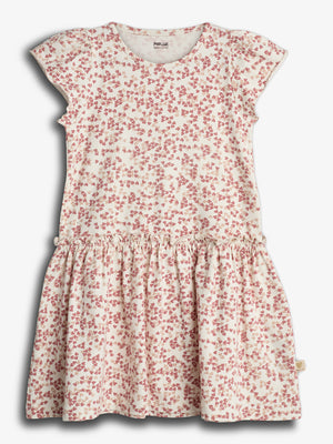 A cream-colored, short-sleeve dress is covered in a red butterfly pattern. It features a gathered waist and a casual design for children. Background is plain white.
