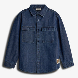 A blue denim shirt with long sleeves and a button-down front displayed against a plain white background. It features two chest pockets and a small label with "p" and "populus."